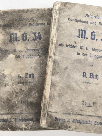 "Beschreibung, Handhabung und Bedienung des M.G. 34 als leichtes M.G., schweres M.G. und in der Fliegerabwehr Teil 1 und 2" datiert 1939, 96 Seiten, DIN A6, Wasserschaden