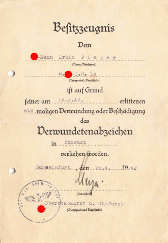 Besitzzeugnis zum Verwundetenabzeichen in schwarz, augestellt 1942 für einen SS-Mann, gelocht