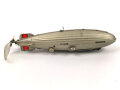 Luftschiff / Zeppelin " LZ 129 Hindenburg" als Kinderspielzeug aus Blech der Firma " Tippco"  Länge 29cm, Original Bemalt, die Luftschraube aus Zelluloid, Funktioniert einwandfrei. Ungereinigtes Stück