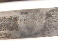 Fahrtenmesser für Angehörige der Hitler Jugend. Stark getragenes Stück mit Devise, Hersteller Hartkopf & Co. Solingen.  Ungereinigt, die Raute nach dem Krieg entfernt und durch ein Stück Kunststoff ersetzt.