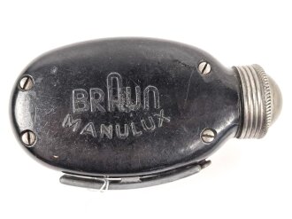 Dynamo Taschenlampe aus brauner Preßmasse. Hersteller "MANULUX" Funktioniert.
