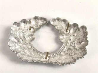 Eichenlaubkranz für eine Schirmmütze des Heeres. Aluminium, ungebraucht. Sie erhalten ein ( 1 ) Stück