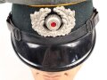 Heer, Schirmmütze für Mannschaften der Kavallerie. Kopfgrösse 57. Getragenes Stück, etliche Mottenaufrauhungen, sonst in gutem Gesamtzustand
