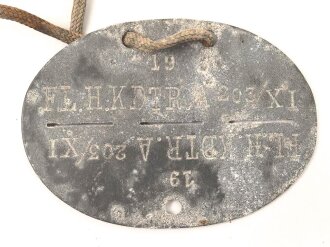 Erkennungsmarke aus Zink " Fliegerhorst Kommandantur A. 203/ XI""