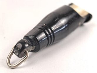 Trillerpfeife aus dunkelbrauner Preßmasse, guter Zustand