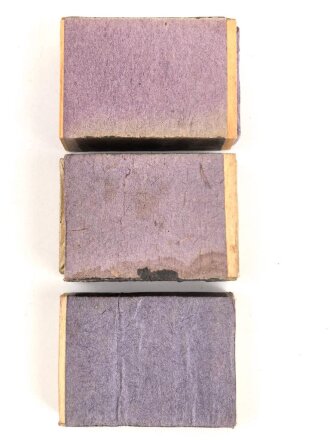 Drei Stück Zündholzverpackungen, meist leer