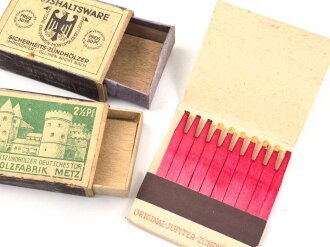 Drei Stück Zündholzverpackungen, meist leer