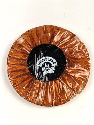 Halber Inhalt einer  Scho-ka-kola Dose Wehrmacht