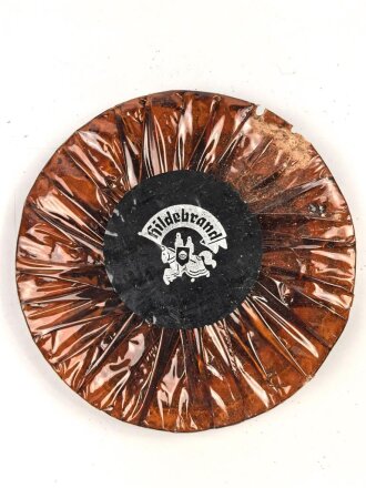 Halber Inhalt einer  Scho-ka-kola Dose Wehrmacht