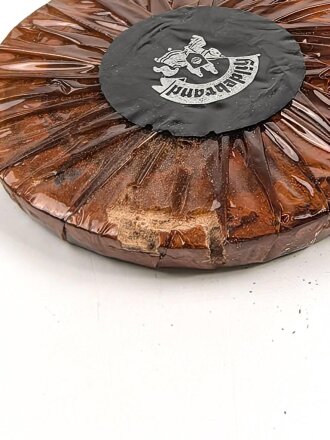 Halber Inhalt einer  Scho-ka-kola Dose Wehrmacht