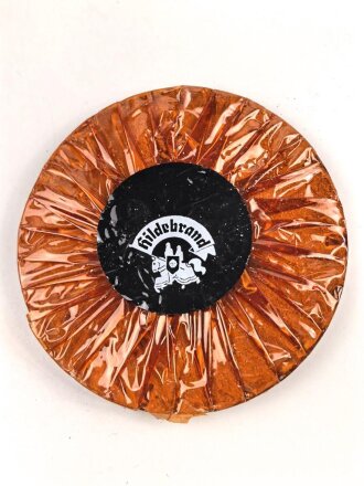 Halber Inhalt einer  Scho-ka-kola Dose Wehrmacht