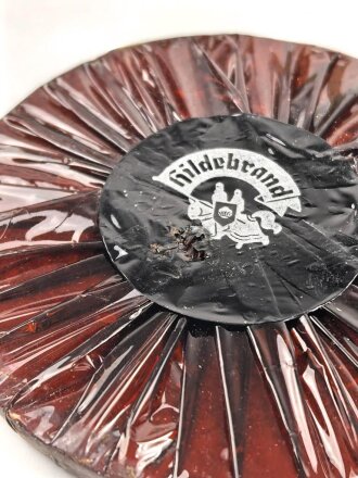 Halber Inhalt einer  Scho-ka-kola Dose Wehrmacht