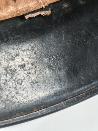 Feuerwehr III.Reich, Stahlhelm Originallack. Nach dem Krieg weiterverwendet. Kinnriemen ergänzt, Leuchtband angebracht, Embleme überklebt.