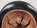 Stahlhelm Feuerwehr, vermutlich aus den 1930iger Jahren . Originallack, Embleme sauber entfernt, Kinnriemen einseitig abgerissen