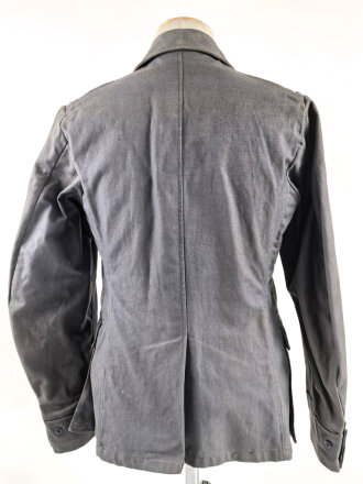 Luftwaffe, blaue Tropenfeldbluse 1. Modell. Kammerstück von 1941. Leicht angeschmutzt, der Brustadler original vernäht, leicht getragenes Stück