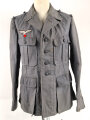 Luftwaffe, blaue Tropenfeldbluse 1. Modell. Kammerstück von 1941. Leicht angeschmutzt, der Brustadler original vernäht, leicht getragenes Stück