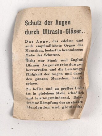 Allgemeine Schutzbrille Wehrmacht in Hülle aus Ersatzmaterial. Umbral Gläser ( getönt) , mit beiliegendem Hinweiszettel, dieser mit Druckvermerk von 1942