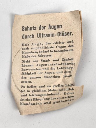 Allgemeine Schutzbrille Wehrmacht in Hülle aus Ersatzmaterial. Umbral Gläser ( getönt) , mit beiliegendem Hinweiszettel, dieser mit Druckvermerk von 1942