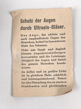 Allgemeine Schutzbrille Wehrmacht in Hülle aus Ersatzmaterial. Umbral Gläser ( getönt) , mit beiliegendem Hinweiszettel, dieser mit Druckvermerk von 1942