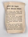 Allgemeine Schutzbrille Wehrmacht in Hülle aus Ersatzmaterial. Umbral Gläser ( getönt) , mit beiliegendem Hinweiszettel, dieser mit Druckvermerk von 1942