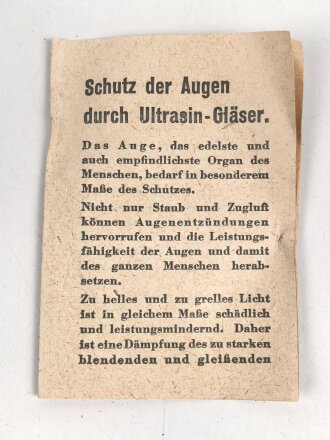 Allgemeine Schutzbrille Wehrmacht in Hülle aus Ersatzmaterial. Umbral Gläser ( getönt) , mit beiliegendem Hinweiszettel, dieser mit Druckvermerk von 1942