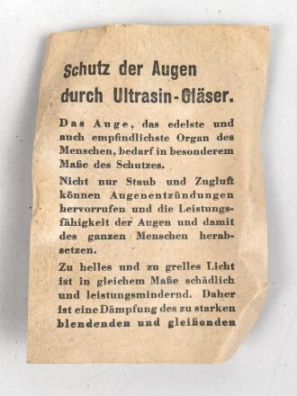 Allgemeine Schutzbrille Wehrmacht in Hülle aus Ersatzmaterial. Umbral Gläser ( getönt) , mit beiliegendem Hinweiszettel, dieser mit Druckvermerk von 1942