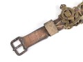 British most likely WWII , 12 cap badges attached to hand made belt. Uncleaned