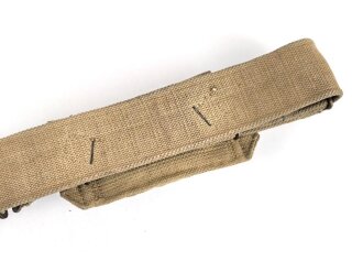 British 1940 dated three piece construction web belt, with pistol holster and ammo pouch. Buckles for braces removed, good condition