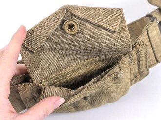 British 1940 dated three piece construction web belt, with pistol holster and ammo pouch. Buckles for braces removed, good condition