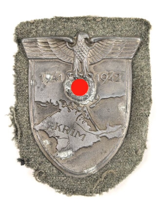 Krimschild 1941/42 , Zink mit resten der  bronzierung. Getragenes Stück