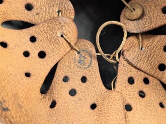 Heer, Stahlhelm Modell 1942. In allen Teilen original , das Innenfutter vermutlich in der Zeit gewechselt, früher Kinnriemen ergänzt, das Hakenkreuz vollständig erhalten. Hersteller EF 64. Ungereinigt