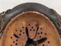 Heer, Stahlhelm Modell 1942. In allen Teilen original , das Innenfutter vermutlich in der Zeit gewechselt, früher Kinnriemen ergänzt, das Hakenkreuz vollständig erhalten. Hersteller EF 64. Ungereinigt
