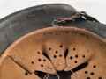Heer, Stahlhelm Modell 1942. In allen Teilen original , das Innenfutter vermutlich in der Zeit gewechselt, früher Kinnriemen ergänzt, das Hakenkreuz vollständig erhalten. Hersteller EF 64. Ungereinigt