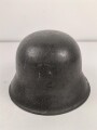Heer, Stahlhelm Modell 1942. In allen Teilen original , das Innenfutter vermutlich in der Zeit gewechselt, früher Kinnriemen ergänzt, das Hakenkreuz vollständig erhalten. Hersteller EF 64. Ungereinigt