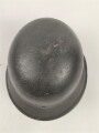 Heer, Stahlhelm Modell 1942. In allen Teilen original , das Innenfutter vermutlich in der Zeit gewechselt, früher Kinnriemen ergänzt, das Hakenkreuz vollständig erhalten. Hersteller EF 64. Ungereinigt