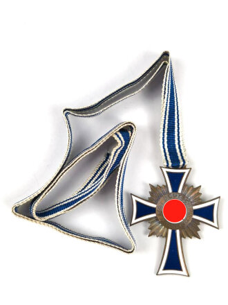 Ehrenkreuz der Deutschen Mutter in bronze, an langem Band. Nicht verausgabtes Stück, aus altem Bestand eines höchstwahrscheinlich Österreichischen Herstellers.