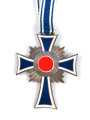 Ehrenkreuz der Deutschen Mutter in bronze, an langem Band. Nicht verausgabtes Stück, aus altem Bestand eines höchstwahrscheinlich Österreichischen Herstellers.
