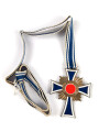 Ehrenkreuz der Deutschen Mutter in bronze, an langem Band. Nicht verausgabtes Stück, aus altem Bestand eines höchstwahrscheinlich Österreichischen Herstellers.