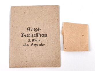 Kriegsverdienstkreuz 2. Klasse ohne Schwerter , kein Hersteller  im Bandring. Original verpackt,  In der zugehörigen Tüte, der Hersteller ausgeschnitten