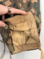 Waffen SS, Tarnhose in der seltenen " glatten" Baumwollausführung. Ungetrages Kammerstück vom Hersteller 179, datiert 1944. In dieser Qualität sehr selten