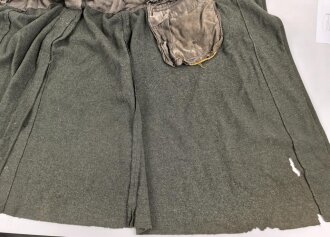 Heer, Mantel für Mannschaften, Kammerstück eines Herstellers aus Warschau. Die Ärmelaufschläge entfernt, auf dem Rücken die Buchstaben PG ( französischer Kriegsgefangener ) noch erkennbar . Stark getragenes Stück