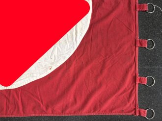 Ortsgruppe " Bruchsal" der NSDAP, große Fahne in nicht ganz vorschriftsmäßiger Ausführung. Deutliche Altersspuren, Maße 110 x 135cm