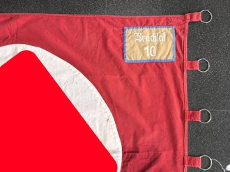 Ortsgruppe " Bruchsal" der NSDAP, große Fahne in nicht ganz vorschriftsmäßiger Ausführung. Deutliche Altersspuren, Maße 110 x 135cm