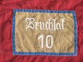 Ortsgruppe " Bruchsal" der NSDAP, große Fahne in nicht ganz vorschriftsmäßiger Ausführung. Deutliche Altersspuren, Maße 110 x 135cm