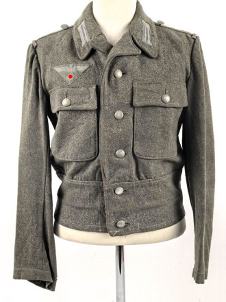 Heer, Feldbluse für Mannschaften Modell 1944. Getragenes Stück , die Effekten original vernäht