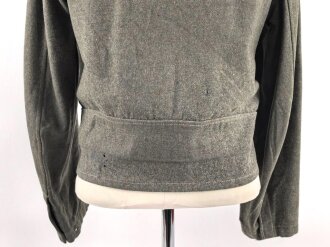 Heer, Feldbluse für Mannschaften Modell 1944. Getragenes Stück , die Effekten original vernäht