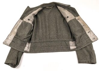 Heer, Feldbluse für Mannschaften Modell 1944. Getragenes Stück , die Effekten original vernäht