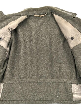 Heer, Feldbluse für Mannschaften Modell 1944. Getragenes Stück , die Effekten original vernäht