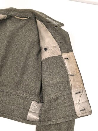 Heer, Feldbluse für Mannschaften Modell 1944. Getragenes Stück , die Effekten original vernäht