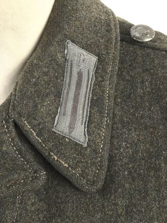 Heer, Feldbluse für Mannschaften Modell 1944. Getragenes Stück , die Effekten original vernäht